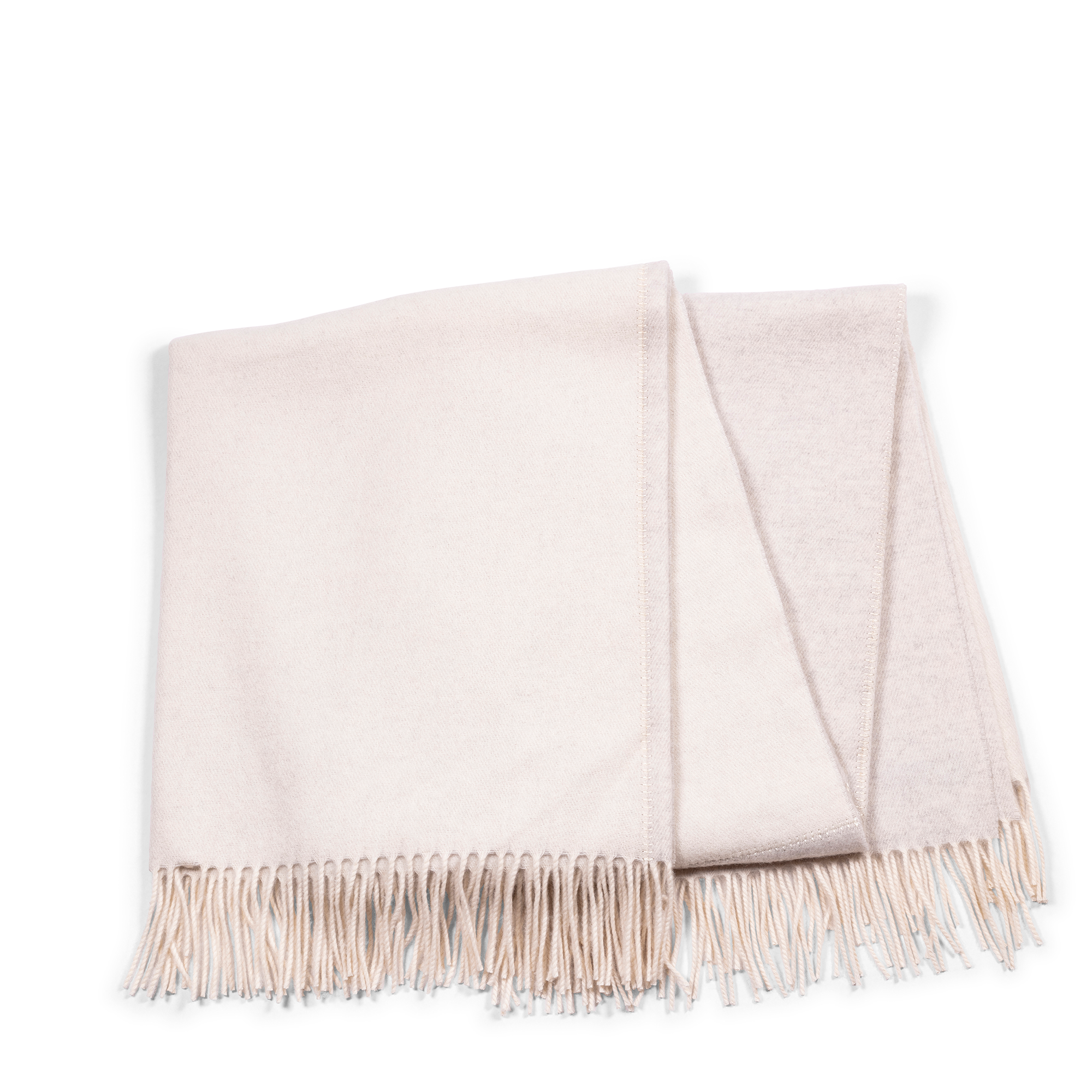 This cashmere throw fits into every home interior, giving a creamy ivory hue and soft light grey on the reverse, and making every room cozy and stylish.