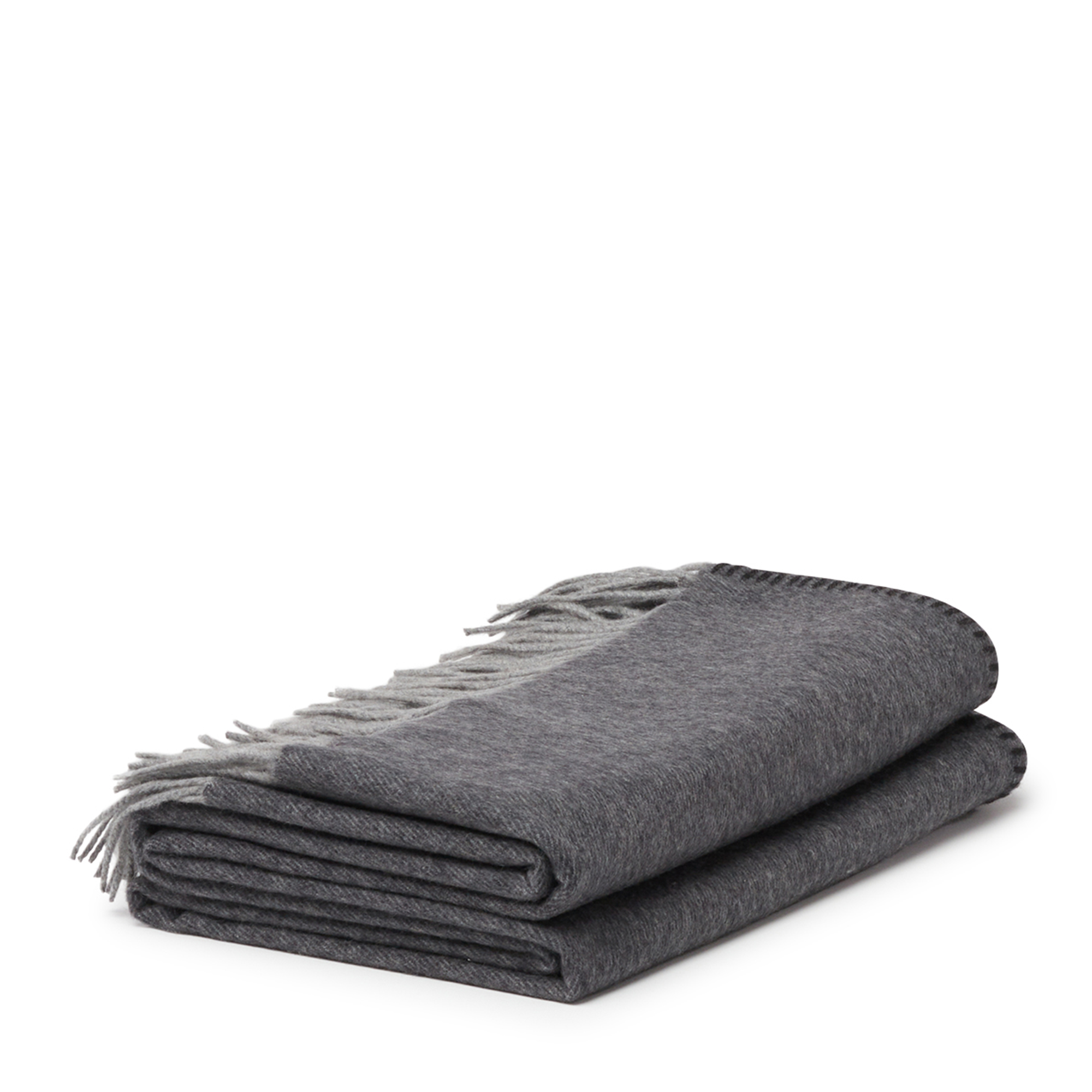 Melrose Two-Tone Throw in Steel and Grey, featuring a double-sided design with an elegant whip-stitched edge. Crafted from 100% cashmere fibers and adorned with delicate hand-crafted fringes, this luxurious throw complements any style and is perfect for every season.