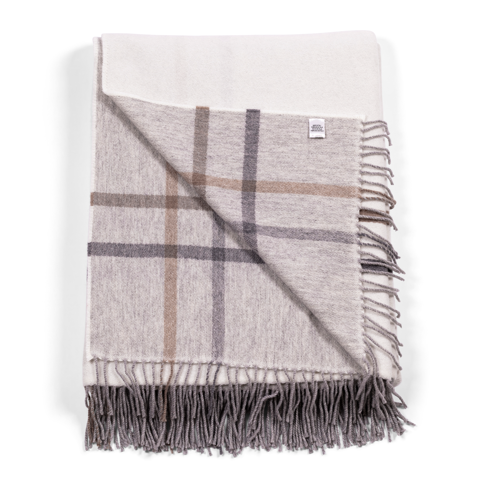 This 100% cashmere throw features delicate fringes, a soft white base with beige and grey accent stripes on one side, and a heathered grey base with a plaid border on the reverse. This elegant throw suits both contemporary and classic interiors.