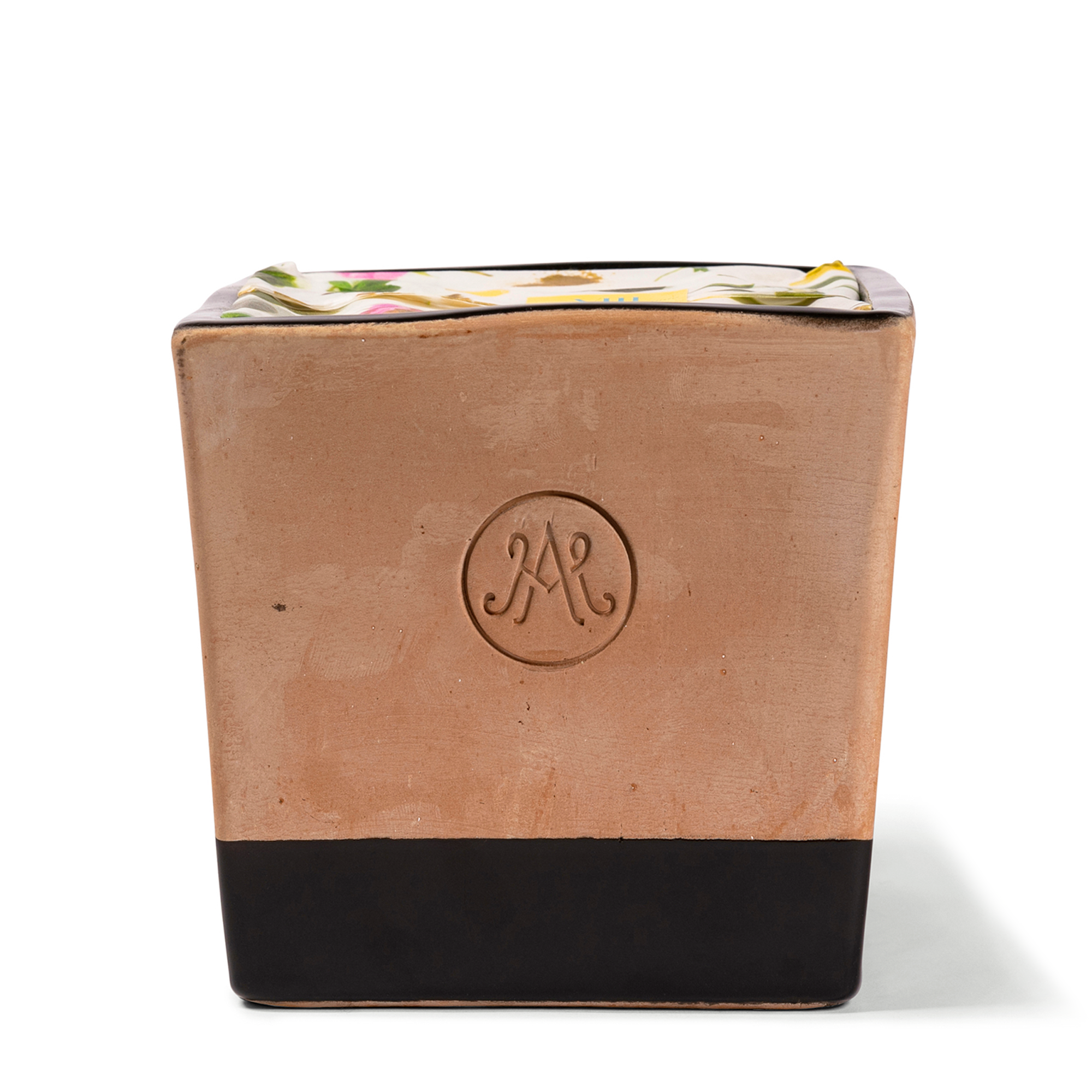 Outdoor Candle in a refillable terracotta and black enamel vessel, scented with green tea, a hint of bergamot, and lemon.