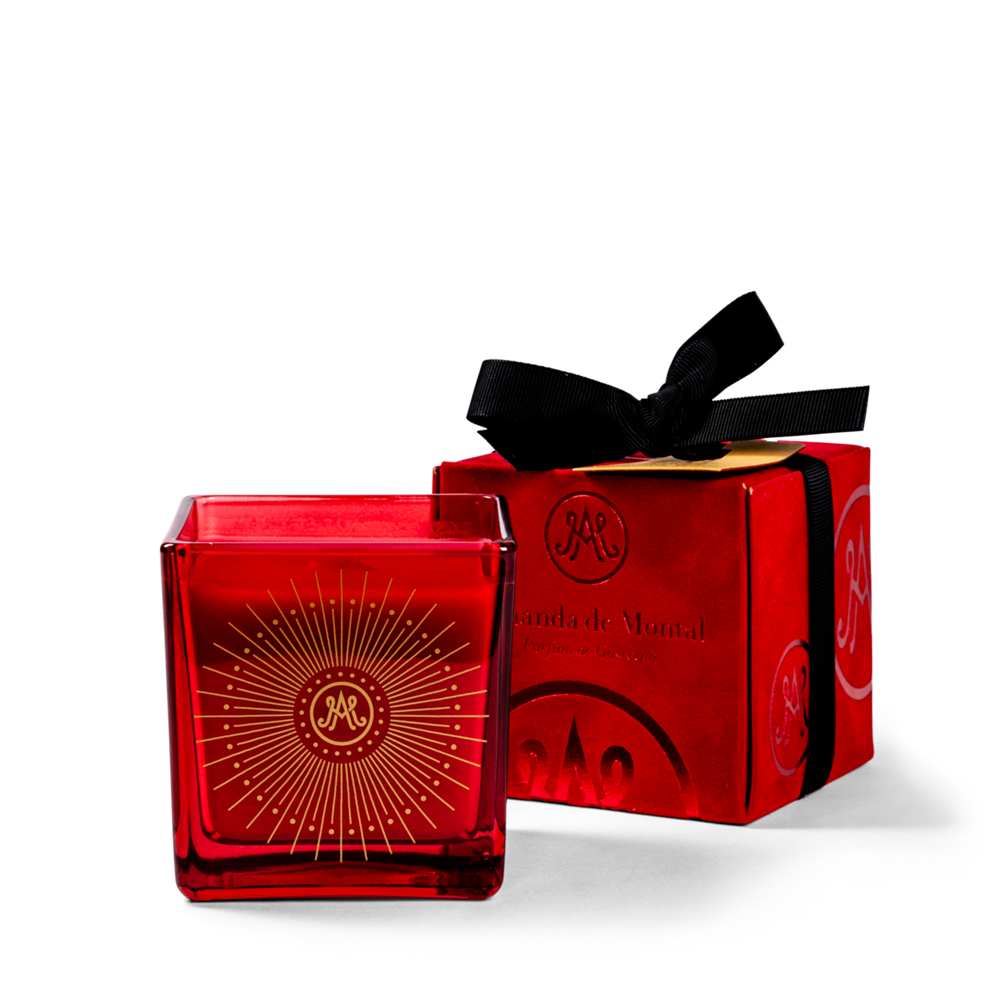 Scented candle with cinnamon, clove, blood orange, vanilla, and musky notes. Presented in an elegant red and gold refillable vessel with a wooden wick, wrapped in a luxurious red velvet box.