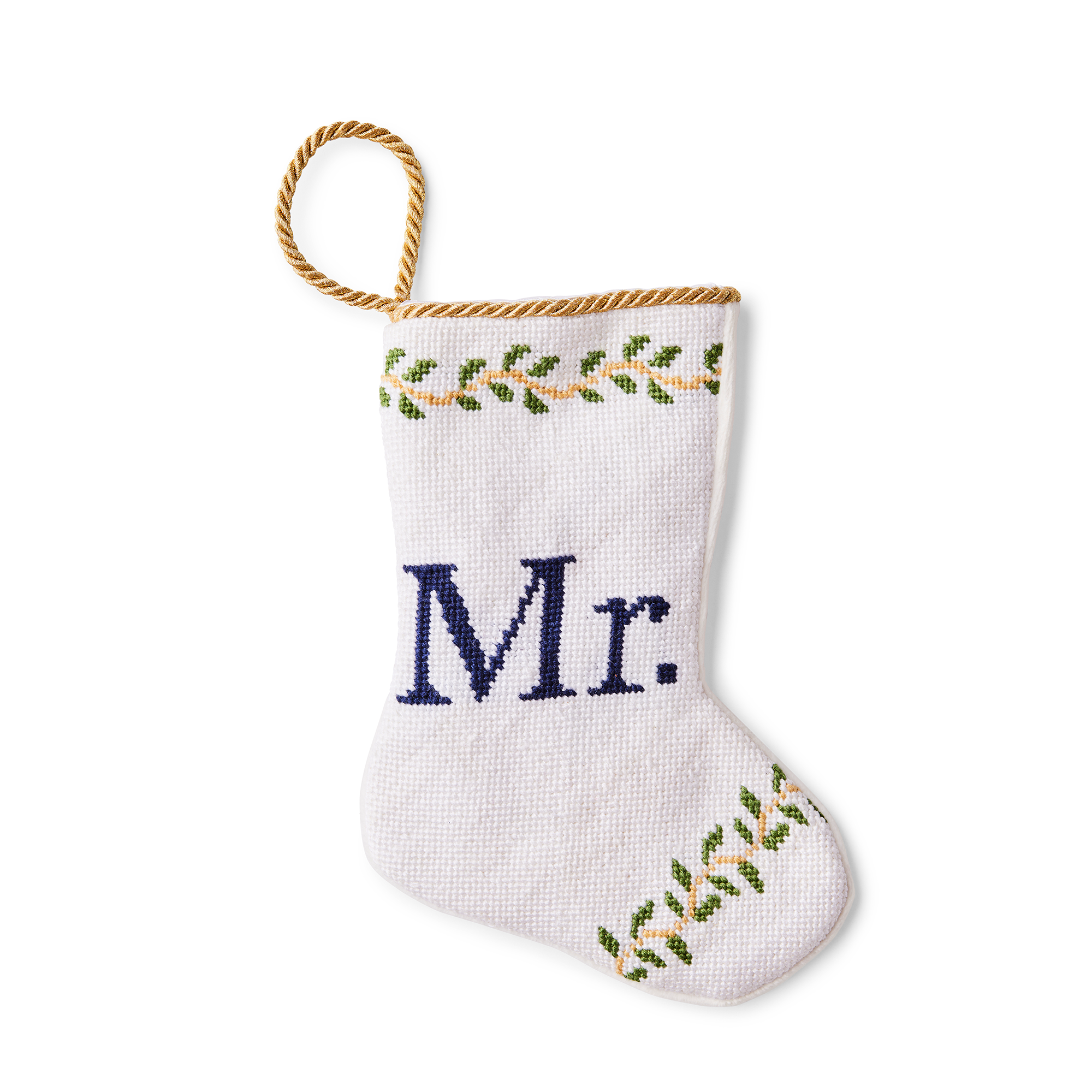A small, intricately designed needlepoint stocking featuring the word 'Mr.' in elegant script. The illustration is set against a delicate, wedding-themed background. Perfect for a place setting, a unique gift, or a clue to it, concert tickets, jewelry or anything else small and thoughtful.