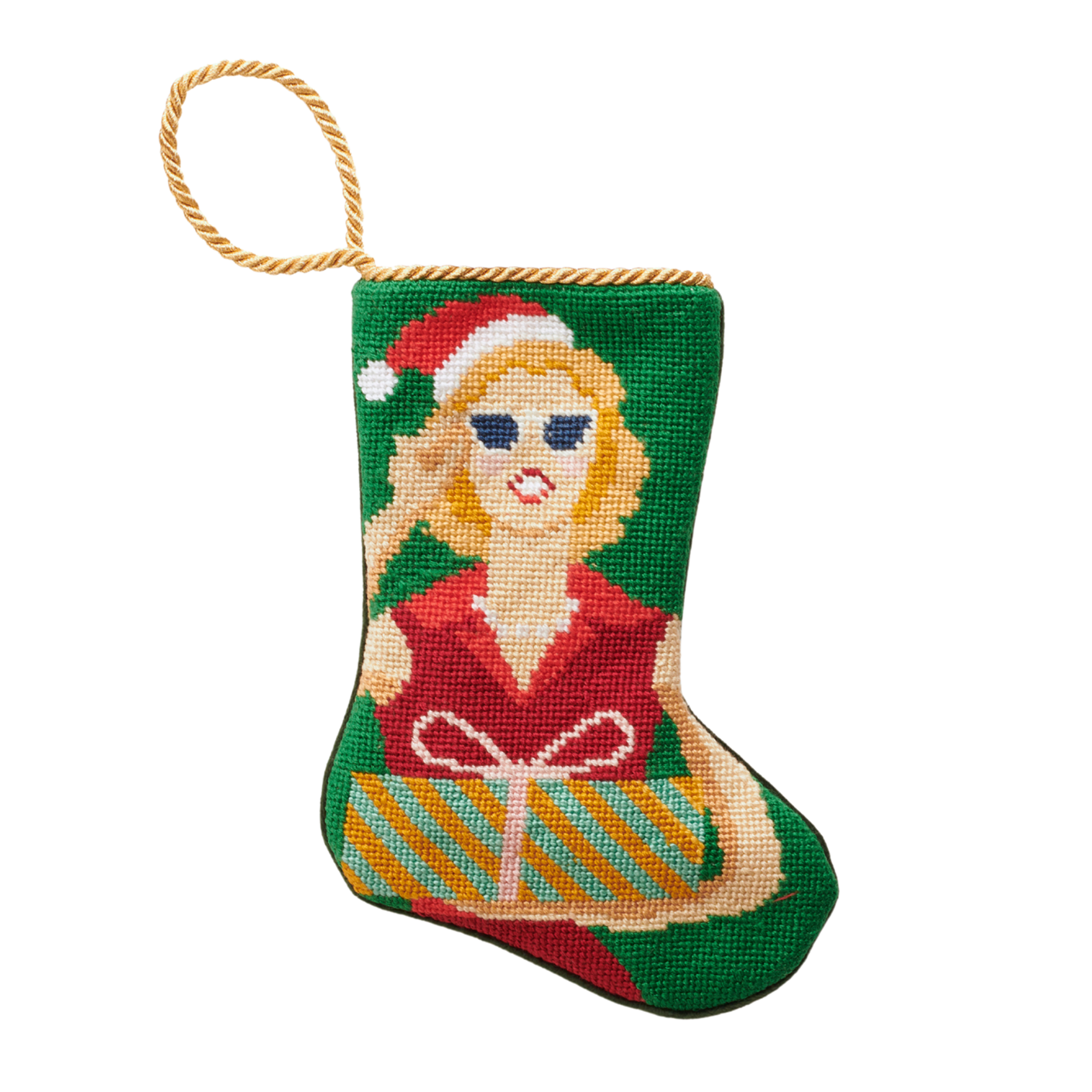A small, intricately designed needlepoint stocking featuring a stylish and glamorous depiction of Mrs. Claus. The vibrant illustration is set against a festive background, highlighting her chic holiday attire. A gold loop at the top makes it perfect as a tree ornament, place setting, or for hanging by the fireplace.