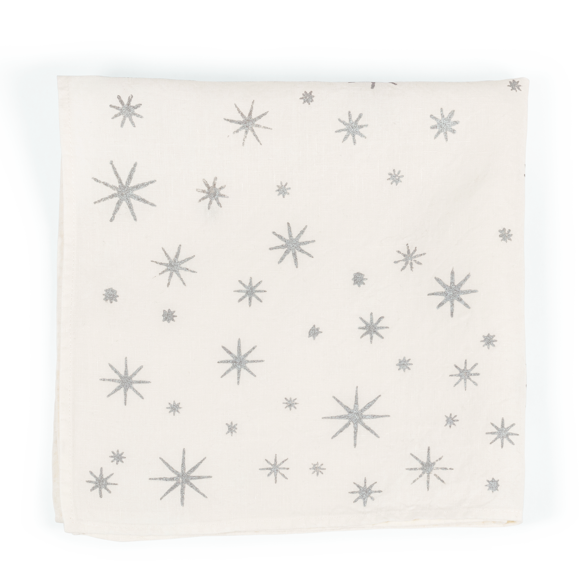 A luxurious white linen napkin with silver stars, perfect for adding a touch of elegance to any table setting.