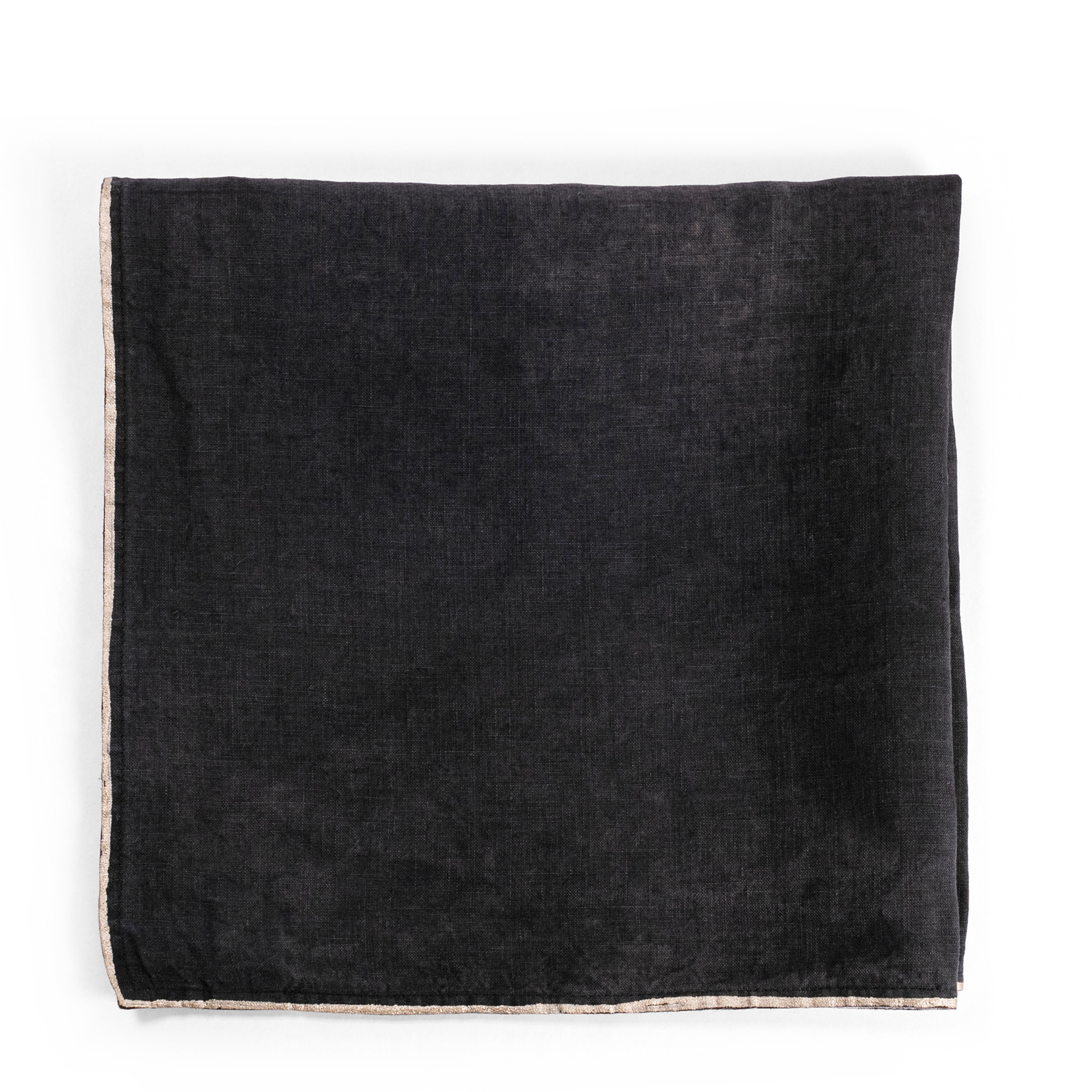 A luxurious black linen napkin with a gold-dipped edge, perfect for adding a touch of elegance and contrast to any table setting.