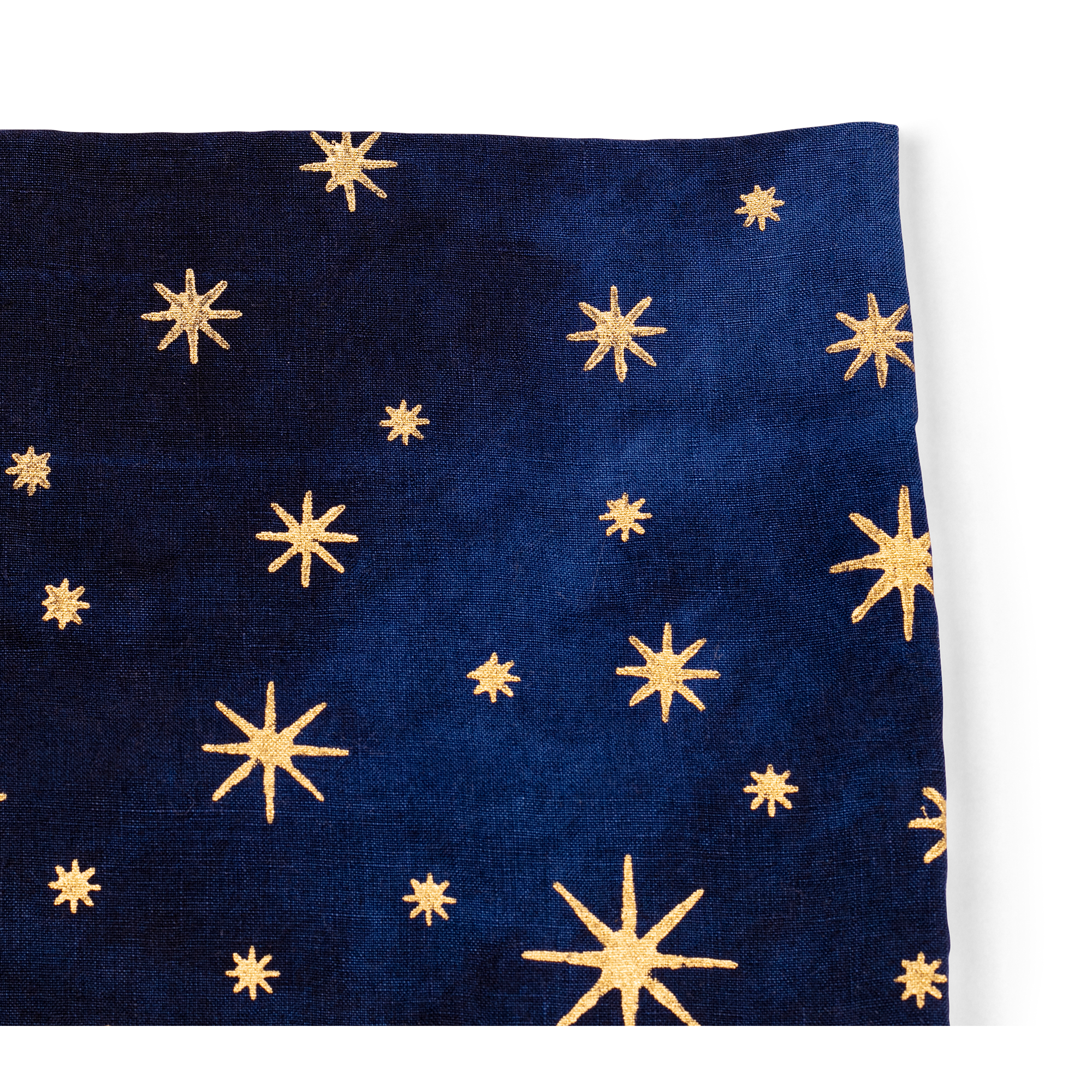 A luxurious indigo linen tea towel with golden stars, perfect for adding a touch of elegance to your table and kitchen.