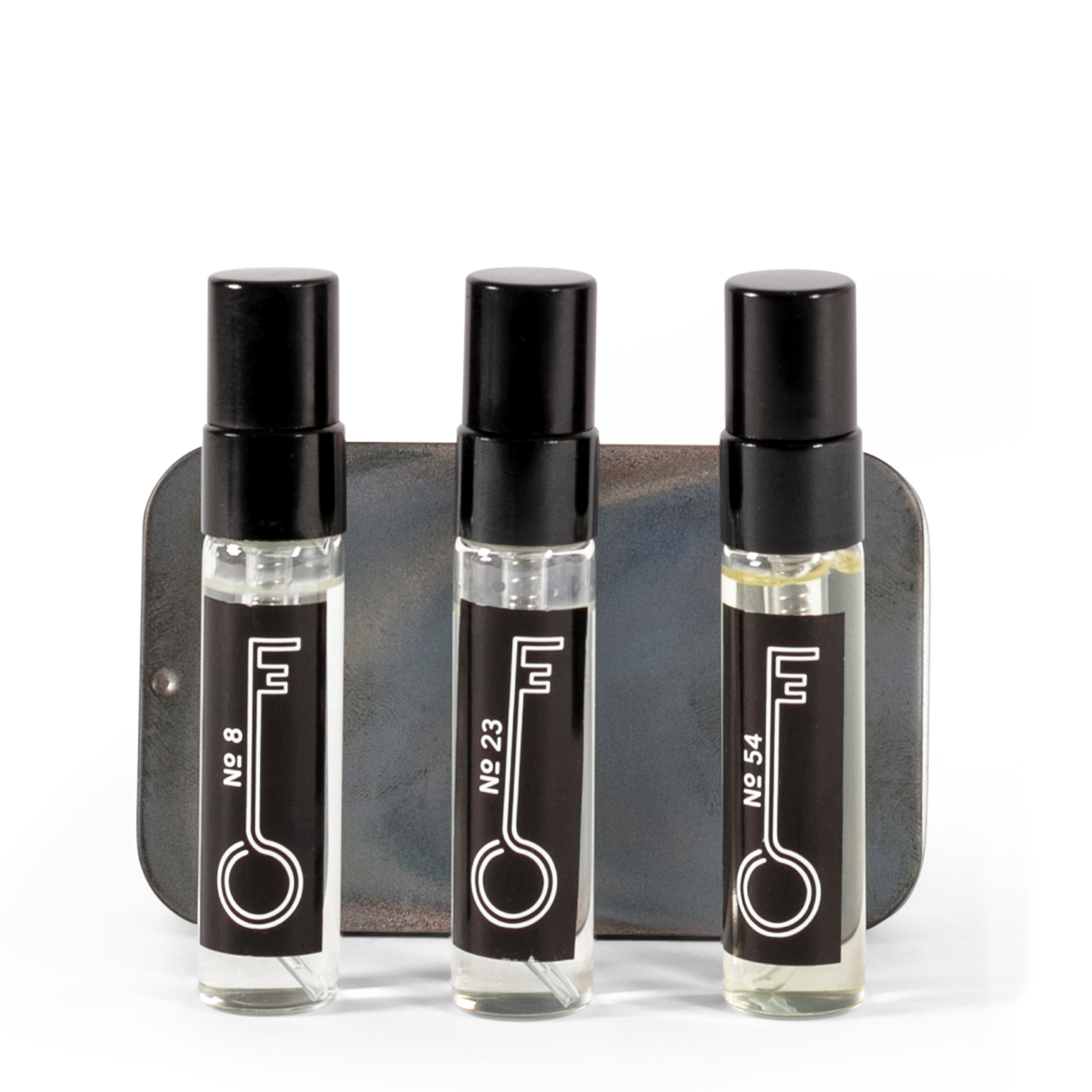 The Fragrance Set includes 5ml bottles of three signature fragrances: No. 8, No. 23, and No. 54.