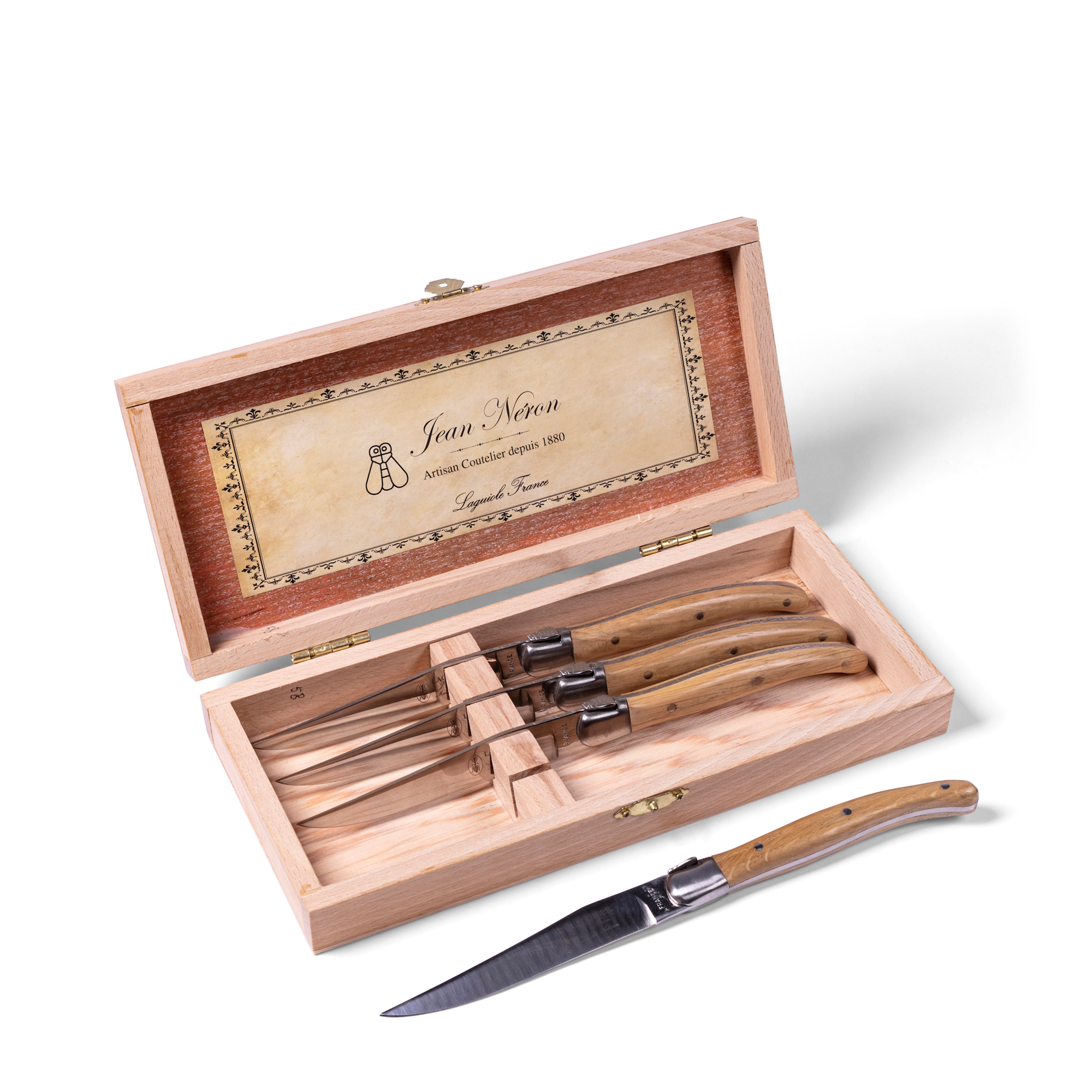 Steak Knives, hand-crafted in France by expert craftsmen, this six-piece steak knife set features mirror-finished blades and oak wood handles embossed with the bee detail synonymous with Laguiole.