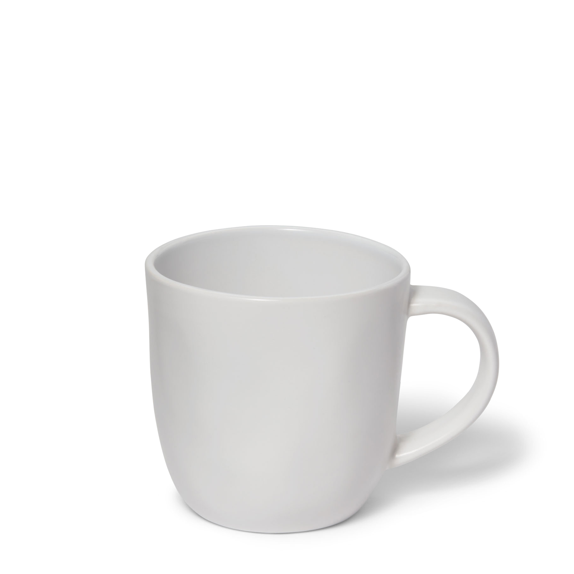 White mug made of stoneware with a satin exterior finish and a glossy interior. Perfect for morning coffee or late night tea. 