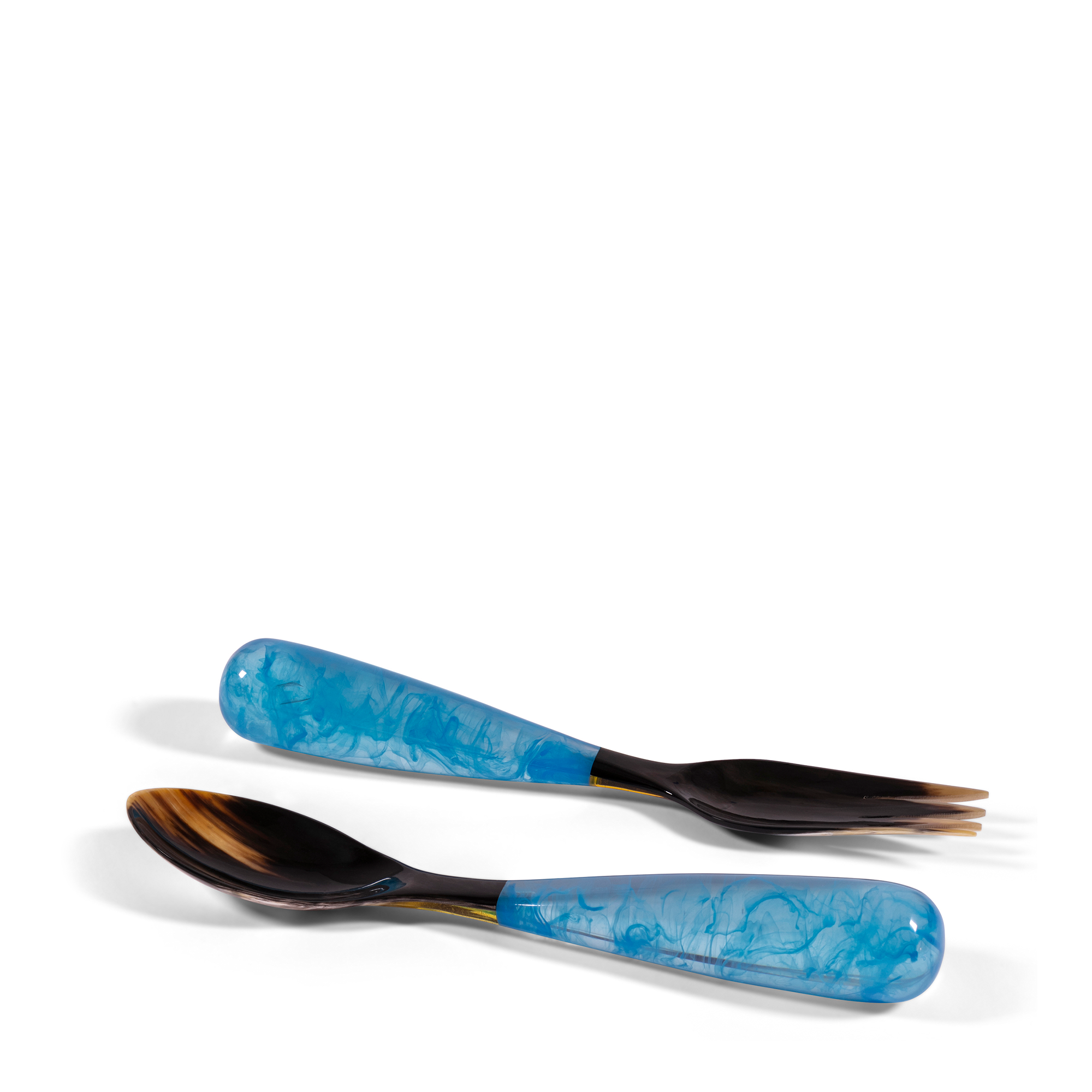 Light Blue Grand Slam Servers, handcrafted from luminous, colorful resin and reclaimed water buffalo horn, these servers combine high-quality polymer resin with horn, offering a unique blend of beauty and durability.