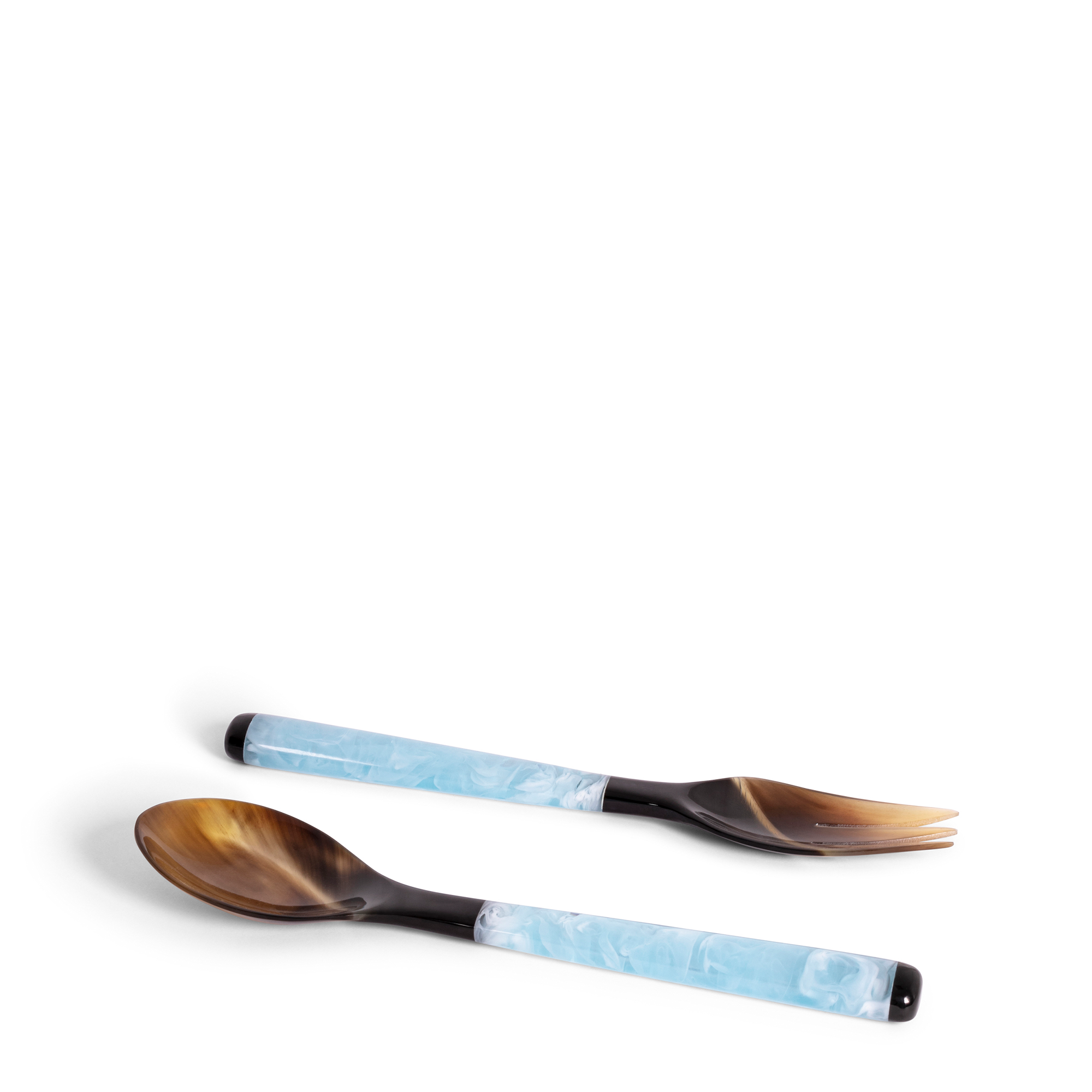 These ice blue popsicle servers are handcrafted from black and ivory horn and luminous resin, where blue and white colors are playing with each other. Perfect for serving salads and sides.