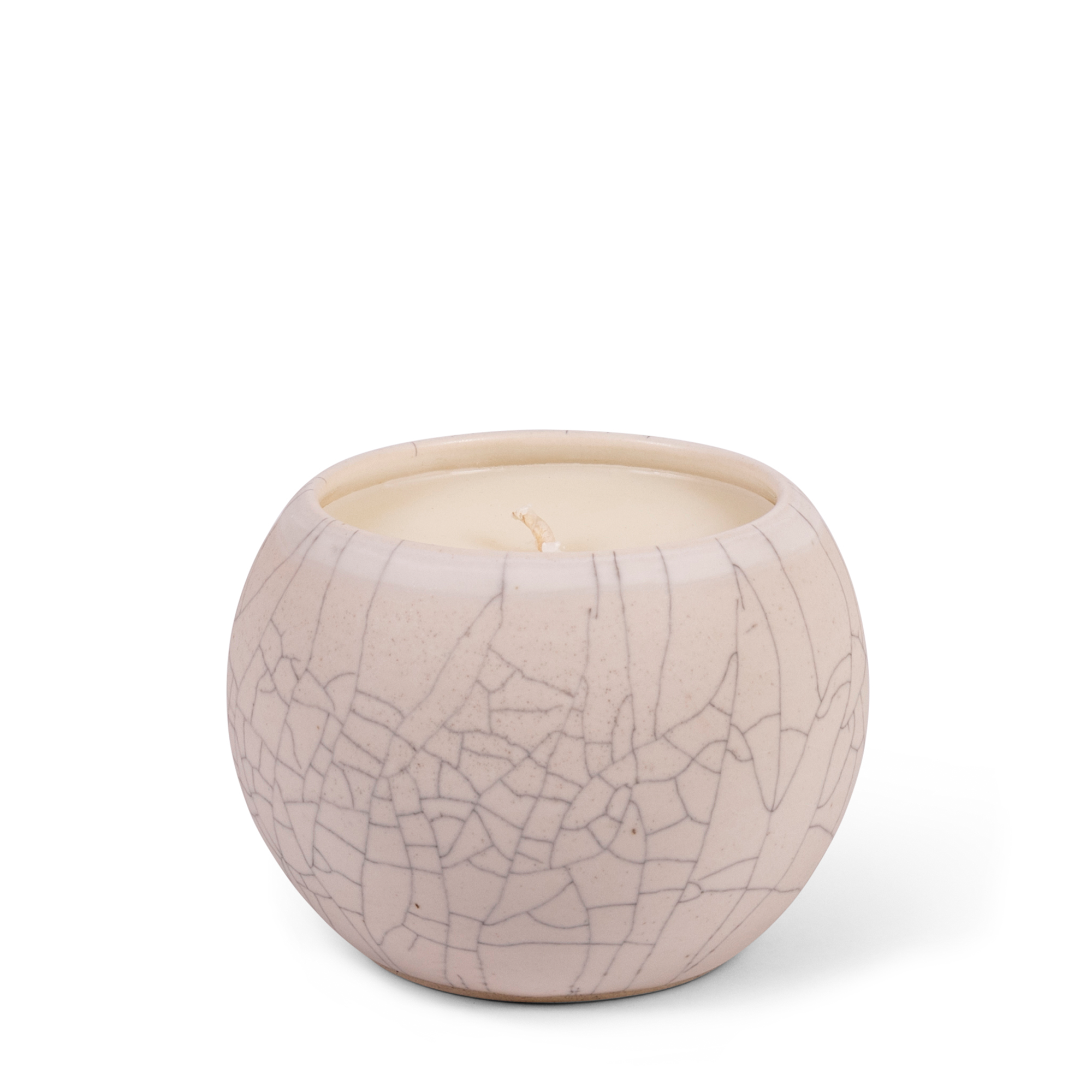 Housed in a beige crackled ceramic vessel, these unique candles are filled with hand-poured coconut wax and infused with santal essential oils.